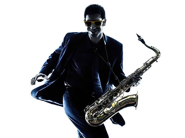 istock A male saxophonist wearing sunglasses and dancing 466347184