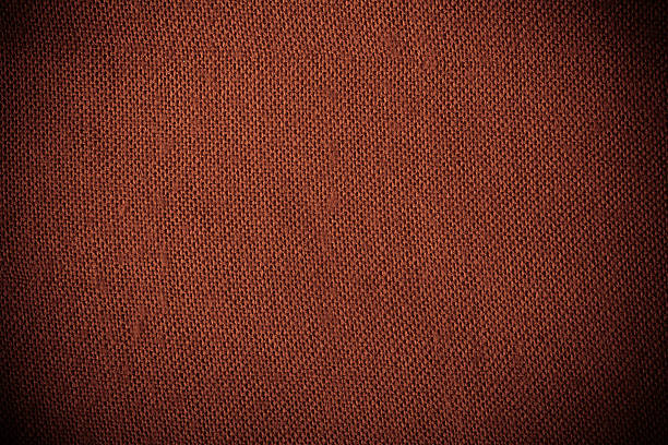 istock Closeup of red brown fabric textile material as texture background 466351983