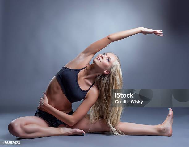 Image Of Smiling Young Woman Doing Stretching Stock Photo - Download Image Now - Activity, Adult, Aerobics