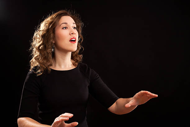 Female choir conductor stock photo