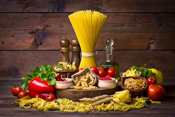 istock Variety of uncooked pasta and vegetables 466353197