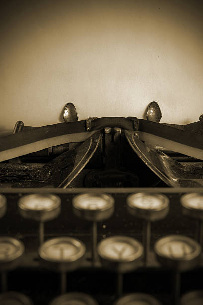 istock Antique typewriter sepia toned with copy space above keyboard. 466353344