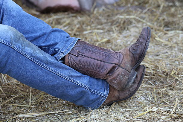 istock Cowboy with leather boots and jeans 466353782