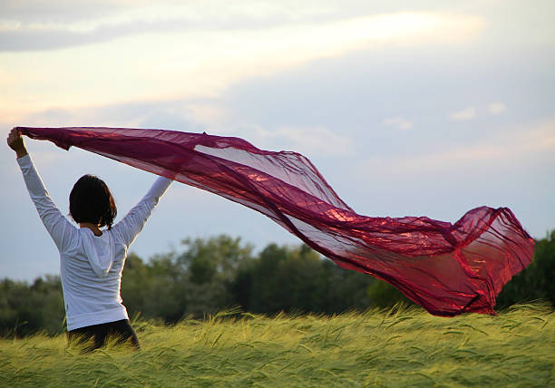 istock With the wind on a green field 466354683