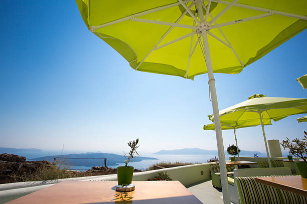 istock Green umbrellas and peaceful sea 466360791