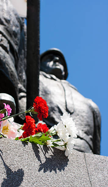 istock flowers near the monument on victory day 466360867