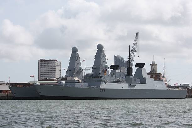 istock large grey warships moored in portsmouth harbour 466361896