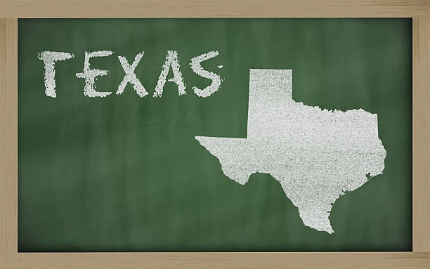 outline map of texas on blackboard stock photo