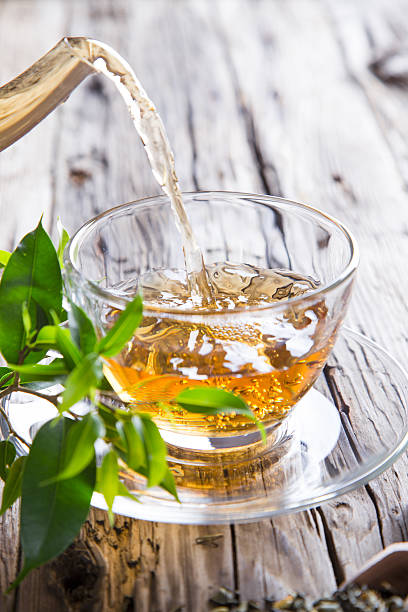 istock Transparent cup of green tea 466366963