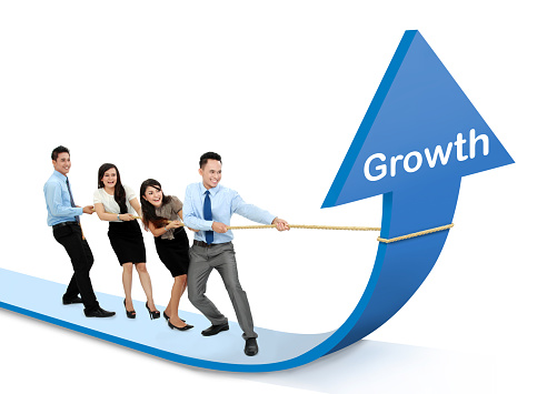 portrait of business team pulling up bar using rope. growth chart concept