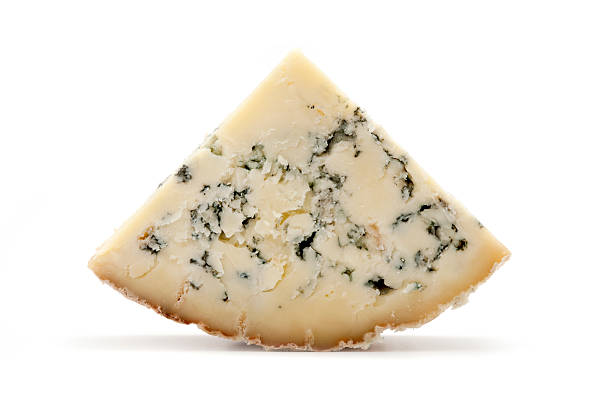 Blue Stilton cheese Slice of blue Stilton cheese on a white background blue cheese stock pictures, royalty-free photos & images