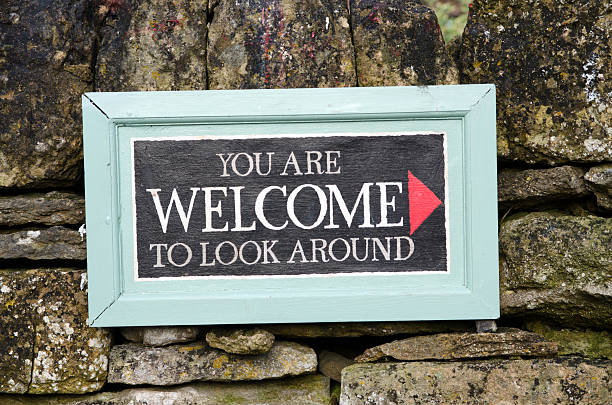 You are welcome to look around sign stock photo