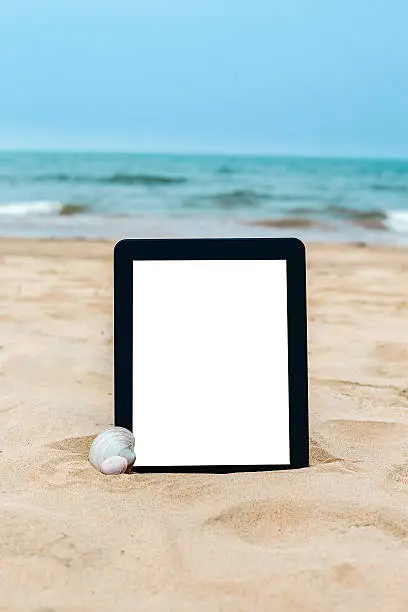 Photo of digital Tablet on beach