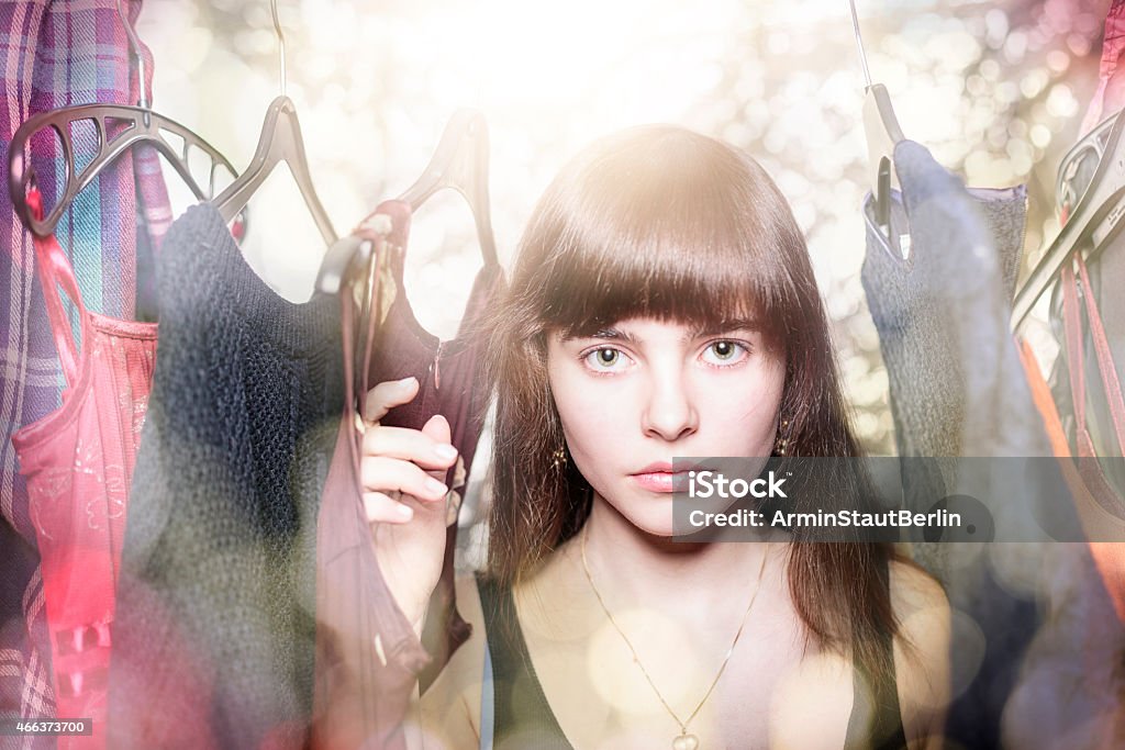 dreamy portrait of a teenage girl with her wardrobe dreamy portrait of a teenage girl with her wardrobe, with backlit and bokeh 2015 Stock Photo