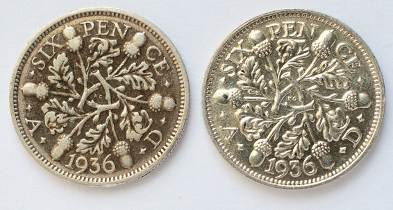 Here are two sixpences, silver coins both dated 1936. (Actually, by this date, British coins were only half made of silver.) One of them has had a hard life, showing wear and black oxidisation of the metal. The other, possibly with the benefit of some later cleaning, looks almost as detailed as when it was first minted. 1936 was in the reign of King George V, whose portrait adorns the obverse / front of these two coins. A variety of British sixpenny pieces, sixpences, front and back: .