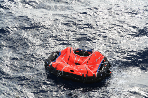 Life raft adrift in mid ocean