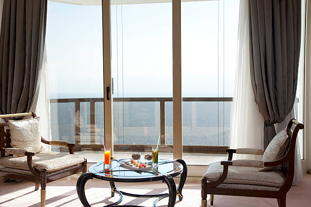 istock comfy armchairs in front of the window 466376120