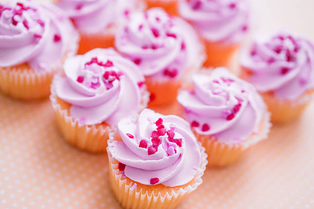 istock Cupcakes with pink cream and heart sprinkles 466376483