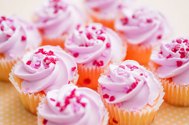 istock Cupcakes with pink cream and heart sprinkles 466376491