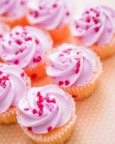 istock Cupcakes with pink cream and heart sprinkles 466376505