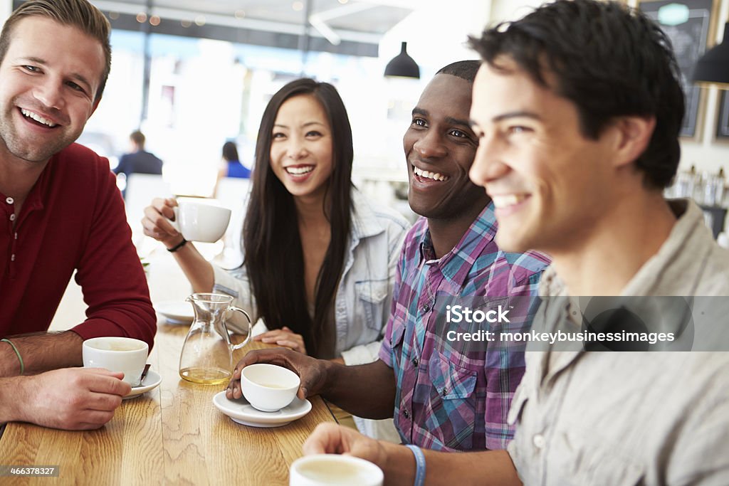 Group Of Friends Meeting In Coffee Shop Happy Smiling Group Of Friends Meeting In Coffee Shop 20-29 Years Stock Photo