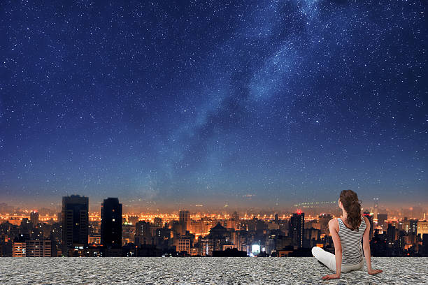 Asian woman looking on night city stock photo