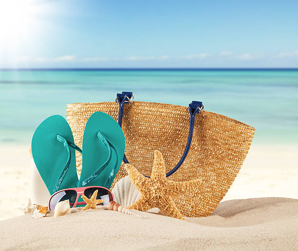 istock Summer beach with blue sandals and shells 466379260
