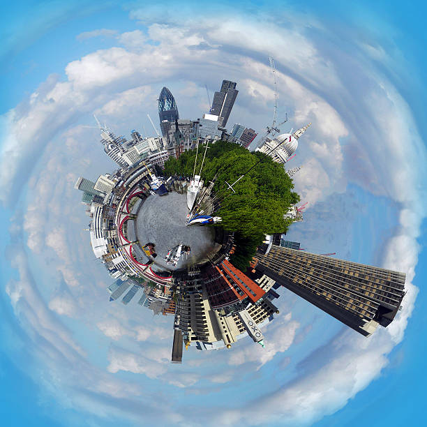 Abstract image of London as a planet Tiny Planet Panorama of London Skyline from the Embankment. fish eye lens photos stock pictures, royalty-free photos & images