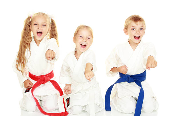 istock Children sitting in a ritual pose karate punch arm 466387803