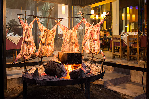 Cooking Goats over Coals stock photo