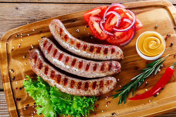 istock grilled sausages on the grill on the board 466391496
