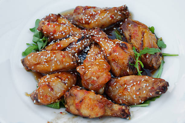 Chiken wings with hot sauce Chiken wings with hot sauce with sesame sticky sesame chicken sauces stock pictures, royalty-free photos & images