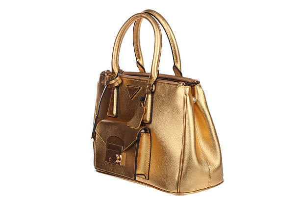 istock Golden leather handbag on white background 466394782