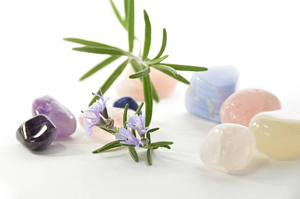 gemstones with rosemary in white background