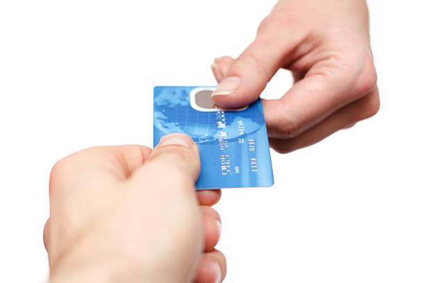 istock Hands swapping a blue credit card isolated on white 466397693