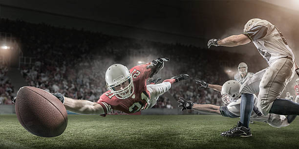 istock American Football Player Scores Touchdown 466399663
