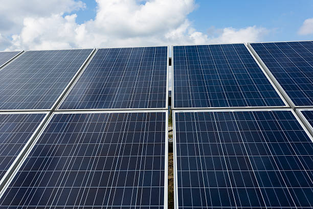 istock solar energy panels and wind turbines 466400624