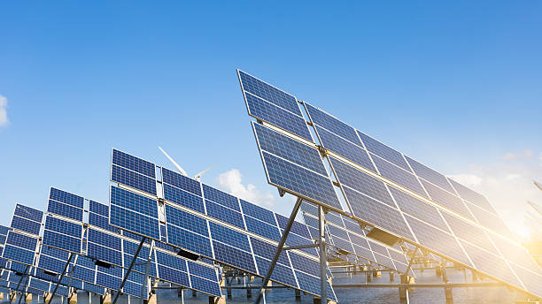 istock solar energy panels and wind turbines 466400798