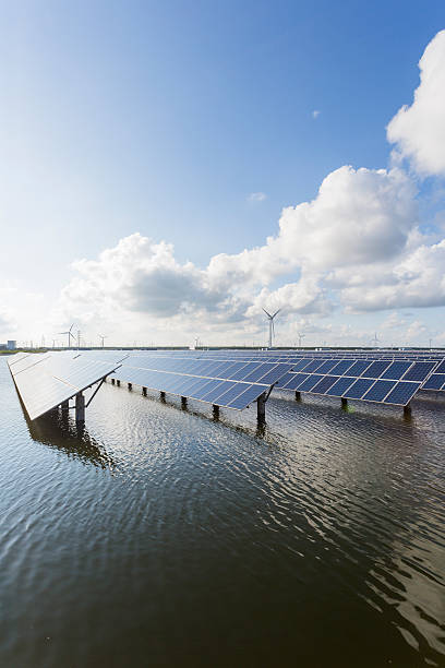 istock solar energy panels and wind turbines 466401416