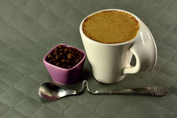 istock Cup of coffee with milk and spices seed grain 466403792