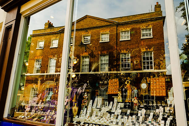 istock shop window is mirroring a house 466405077
