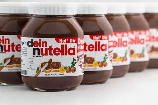 Sarajevo, Bosnia and Herzegovina - March 10, 2015: Jars of Nutella Hazelnut Spread entitled dein nutella (Your Nutella) with the option of personalised labels. Each customer can order two free labels, including QR codes, displaying a first name and a nickname.  Nutella is the brand name of a chocolate hazelnut flavored sweet spread by the Italian company Ferrero.