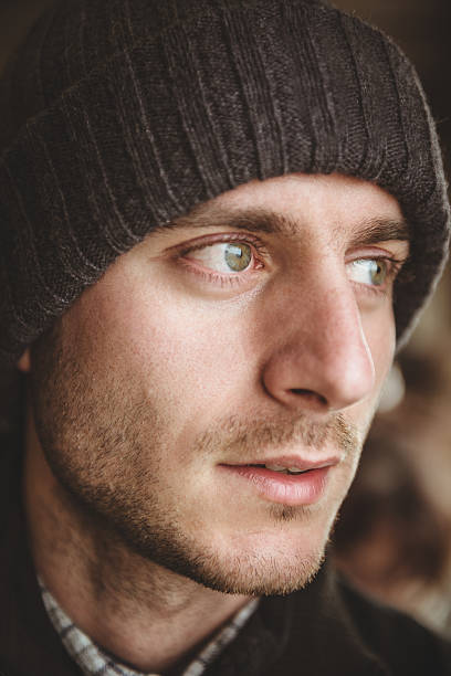 istock caucasian pensive man with knit hat portrait 466409417