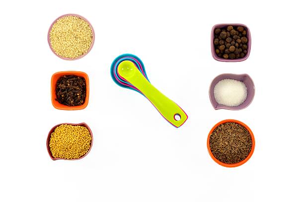 istock Seeds, spices, grains in small multi-colored cups and measuring spoons 466409638