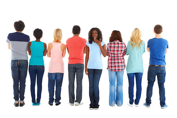 istock Surprised young girl standing out from the crowd 466412371