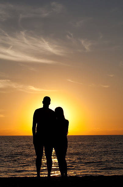 istock Couple on the Beach at Sunset 466412681