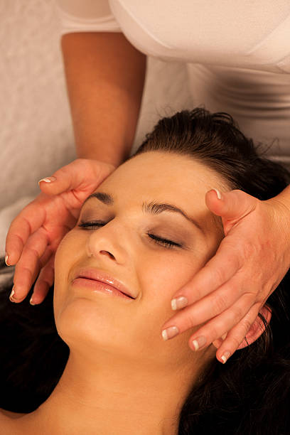 istock Woman having face massage treatment in wellness 466413410