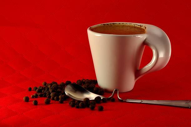 istock Cup of coffee with milk and spices seed grain 466413626