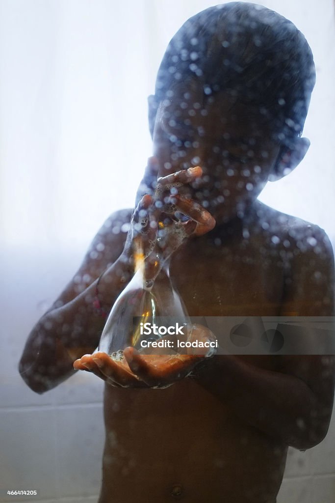 Soap bubble Young boy is having fun during a shower with a giant bubble soap. Bubble Stock Photo