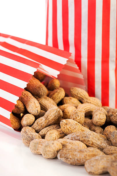 istock Roasted Peanuts in a red and white Paper Bags 466414331